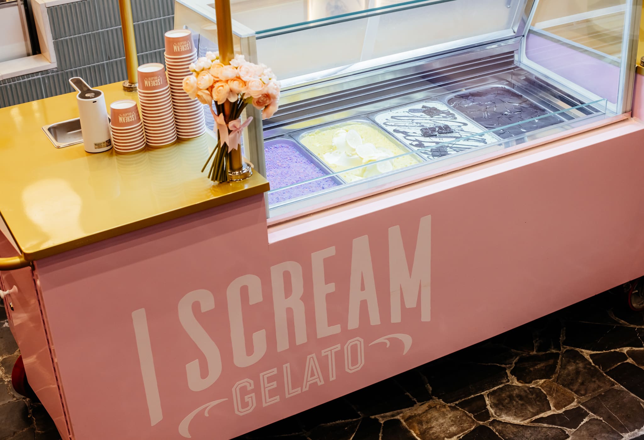 Four pans of gelato on the event cart